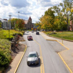 cars drive through downtown Morgantown campus